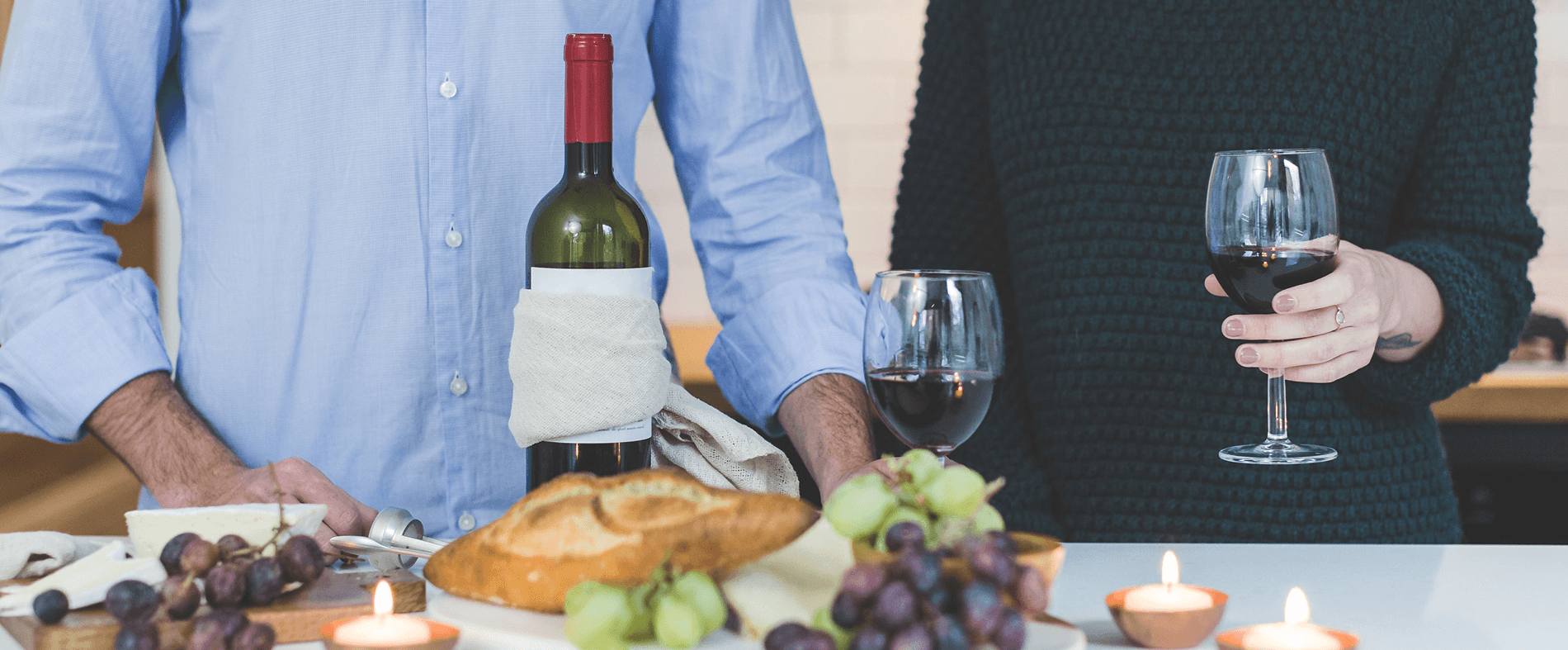 Drinking wine with bread and grapes